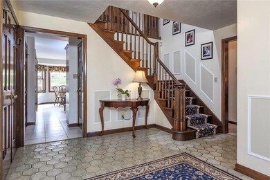 A spacious entry features ceramic tile flooring, p
