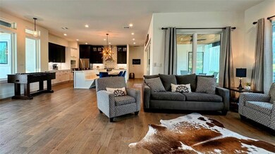 Living area with dark wood-type flooring and rece