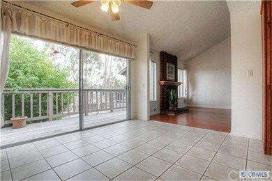 Large sliding doors open up to patio that offer tr