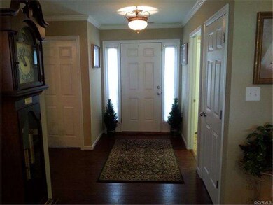 Grand Foyer with Side light windows and Hardwood