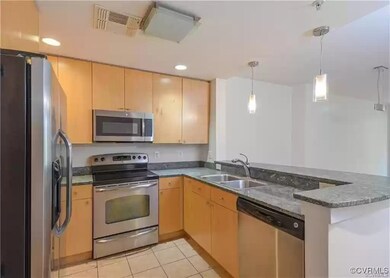 Kitchen featuring visible vents, light brown cabin