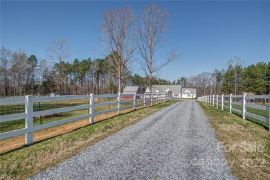 Long fence lined driveway 