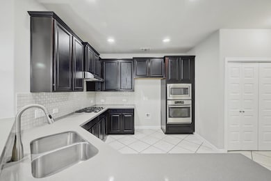 Kitchen featuring appliances with stainless steel