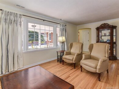 Living room has view of front yard and other goldf