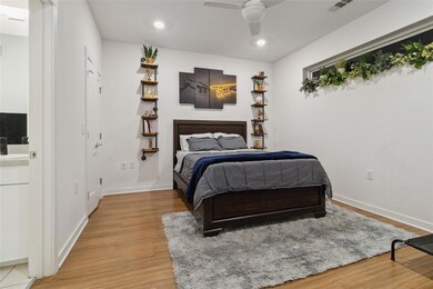 Bedroom featuring light wood-style floors, basebo