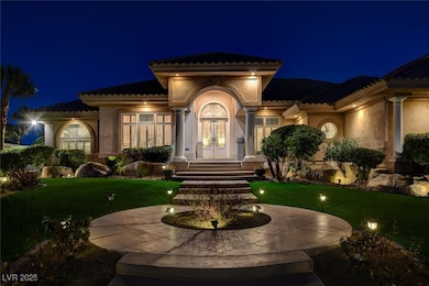 Exterior entry at night with french doors, a tile