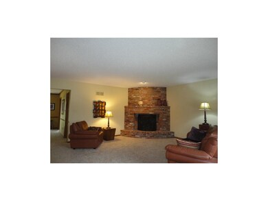 Main Level Great Room w/Corner Brick Fireplace