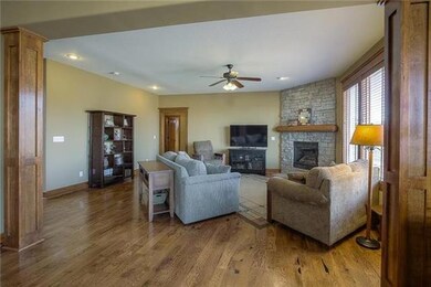 Spacious family room with stacked stone fireplace 