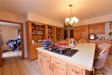 View of the Kitchen looking into the main for laundry room.