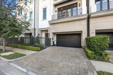 Gated entrance with front green space.