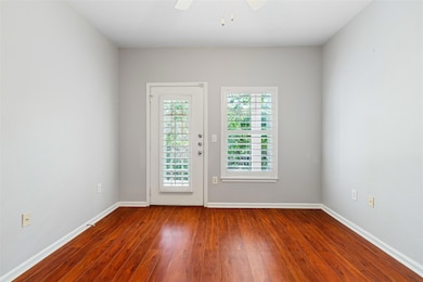 Spare room with wood finished floors, baseboards,