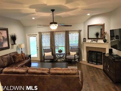 The living area overlooks the back yard and offers