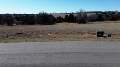 View of asphalt road featuring a view of rural / pastoral area