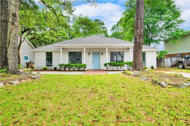 Single story home with roof with shingles, a porch