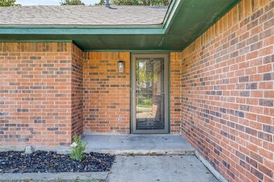 Property entrance featuring roof with shingles and