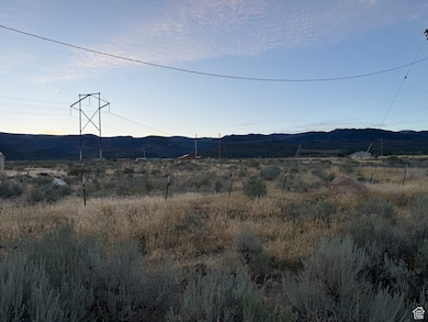 View of mountain backdrop featuring rural landscape