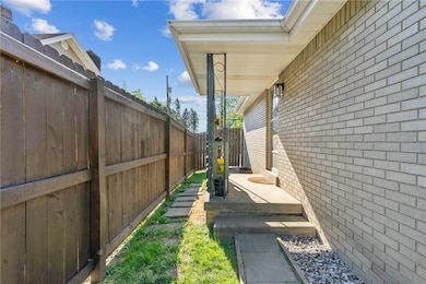 Side porch located off the kitchen.