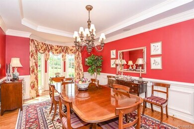 Dining room with Tray ceiling, crown molding, chai