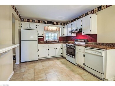 Large eat in kitchen with tons of cabinets and cou