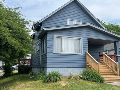 COLONIAL-style home featuring a front yard