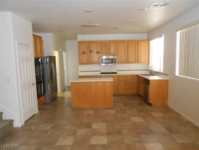 Kitchen with appliances with stainless steel finis
