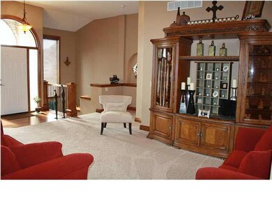 Maple trim with tall floor base. Very open feel an