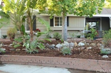 Terraced front yard area with new plants add charm
