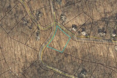 Aerial map of property and surrounding area featuring property boundaries highlighted