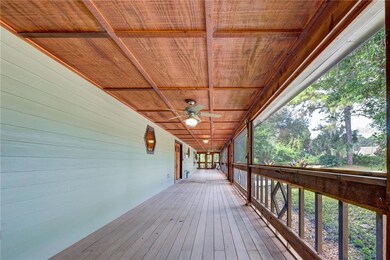 Screened porch the length of the house wraps aroun