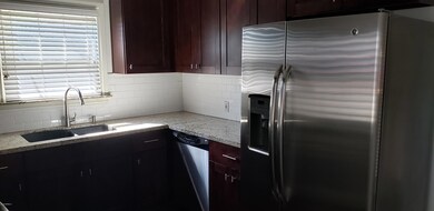 Kitchen with tile backsplash