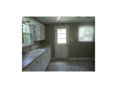 Another View of Kitchen with Entry to Back Yard