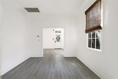 Room between kitchen and front room.