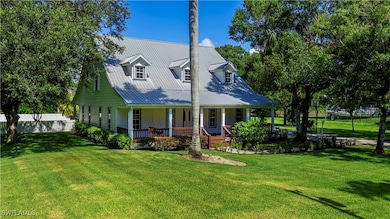 View of front of property with covered porch and a