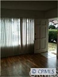 Front entry leads to open living room.