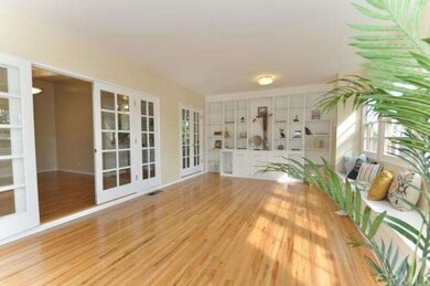 The first set of French doors leads to the living,