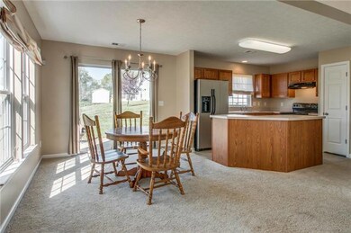 The kitchen right off the dining area features an island bar for added convenience and storage.