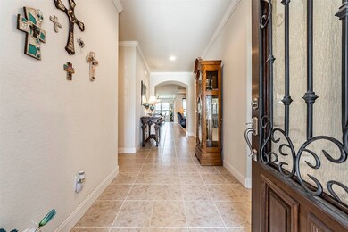 Looking into the tiled entryway from the front doo
