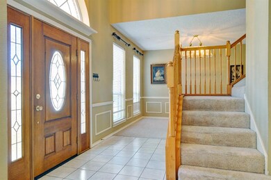 Entry with ceramic tile flooring and view of dinin
