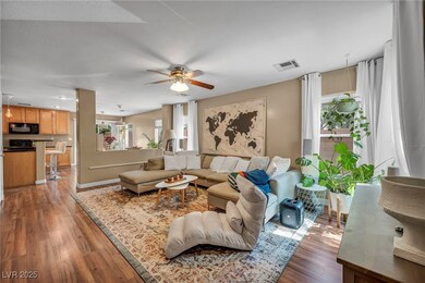 Living area with light wood-type flooring and ceil