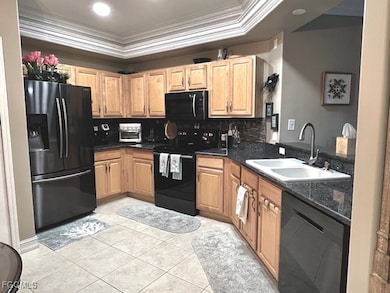Eat-In Kitchen with wood cabinets, granite counters, back splash, stainless appliances and new lighting.