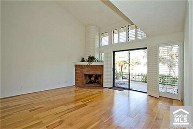 Living Room with Hardwood Flooring and Fireplace, 
