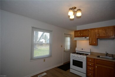 Better view of back door and large kitchen window.