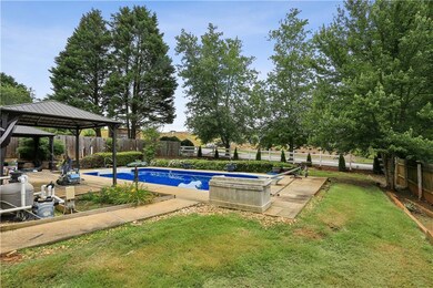 View of swimming pool featuring a gazebo and a patio area
