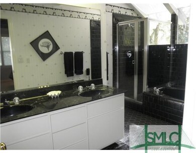 Master Bath/Spa. Black marble counters with double