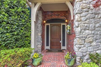 The Covered Front Porch with a mix of Brick and St