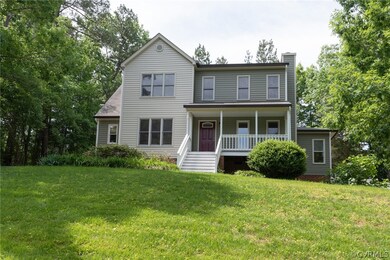 View of front of home featuring a front yard and c