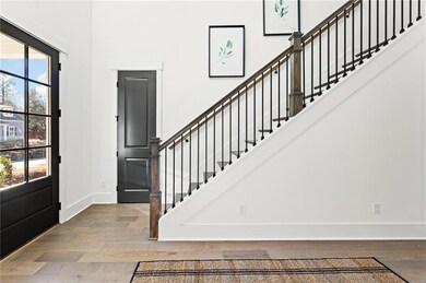 Elegant foyer with soaring ceilings, natural light