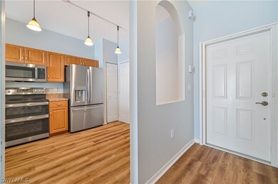 Foyer leading to Kitchen; Front door has a pull ou