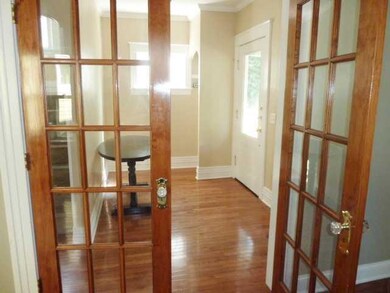 Foyer. French doors open into the living/dining ro