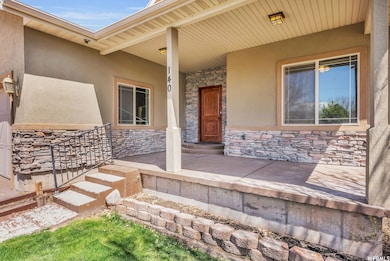 View of exterior entry featuring a yard